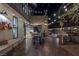 Inviting back patio with wood floors, stone accents, barbecue, and string lights for outdoor dining at 3069 Lascari Ave, Henderson, NV 89044
