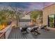 Relaxing backyard with in-deck lounge chairs, fire pit, and outdoor movie screen at 3069 Lascari Ave, Henderson, NV 89044