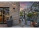 Stylish backyard with stone wall, decorative planters, and seamless indoor-outdoor flow at 3069 Lascari Ave, Henderson, NV 89044
