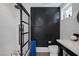 Modern bathroom with a walk-in shower, tiled walls, contrasting walls, and stylish fixtures at 3069 Lascari Ave, Henderson, NV 89044