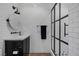 Modern bathroom features a black-framed glass shower, and vanity with black cabinet and a marble countertop at 3069 Lascari Ave, Henderson, NV 89044