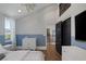 Bedroom featuring neutral tones, natural light, and hardwood floors with seamless transition to living space at 3069 Lascari Ave, Henderson, NV 89044