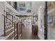 Spacious foyer with soaring ceilings, staircase, and an open view of the modern kitchen at 3069 Lascari Ave, Henderson, NV 89044
