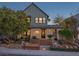 Charming two-story home with stone accents, lush landscaping, and inviting front entrance at 3069 Lascari Ave, Henderson, NV 89044