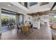 Open-concept kitchen with island, stainless steel appliances, and access to an outdoor patio at 3069 Lascari Ave, Henderson, NV 89044