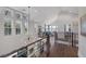 Bright loft area with hardwood floors, modern lighting, and views of the living space below at 3069 Lascari Ave, Henderson, NV 89044