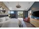 Stylish main bedroom with wood accent wall and private balcony access at 3069 Lascari Ave, Henderson, NV 89044