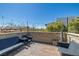 Outdoor patio with stone border, string lights, a gas fireplace and stylish seating at 3069 Lascari Ave, Henderson, NV 89044