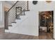 Modern staircase leading to basement wine cellar with custom display at 3069 Lascari Ave, Henderson, NV 89044