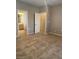 Neutral bedroom showcasing an attached bathroom through a doorway at 332 Wild Plum Ln, Las Vegas, NV 89107