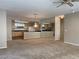 Open-concept living room leading to a kitchen with ample counter space at 332 Wild Plum Ln, Las Vegas, NV 89107