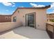 Private balcony with a sliding glass door providing seamless indoor-outdoor flow at 3428 Royal Calloway Ave, Las Vegas, NV 89141