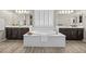 Bathroom featuring a soaking tub and dual vanities at 3428 Royal Calloway Ave, Las Vegas, NV 89141
