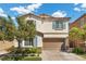 Charming two-story home with a well-manicured front yard and covered entry at 3428 Royal Calloway Ave, Las Vegas, NV 89141