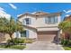 Charming two-story home showcases a well-manicured front yard and a cozy, inviting curb appeal at 3428 Royal Calloway Ave, Las Vegas, NV 89141