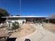 View of the backyard and home, showing lots of potential for landscaping at 3505 W Bonanza Rd, Las Vegas, NV 89107