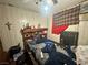 Cluttered bedroom with wood paneled walls and a ceiling fan at 3505 W Bonanza Rd, Las Vegas, NV 89107