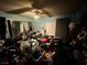 Cluttered bedroom with mirrored closet, ceiling fan, and personal items at 3505 W Bonanza Rd, Las Vegas, NV 89107