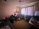 Bedroom with window and curtains, musical equipment, and personal items at 3505 W Bonanza Rd, Las Vegas, NV 89107