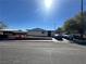 A single-story home with a white vehicle in the driveway under a bright, sunny sky at 3505 W Bonanza Rd, Las Vegas, NV 89107