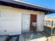 Side view of the home exterior with access door at 3505 W Bonanza Rd, Las Vegas, NV 89107