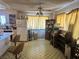 A vintage kitchen with classic tile flooring, wooden cabinets and vintage appliances at 3505 W Bonanza Rd, Las Vegas, NV 89107