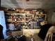 View of a cluttered living room with shelves needing decluttering and renovation at 3505 W Bonanza Rd, Las Vegas, NV 89107