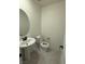 Tastefully decorated half bathroom with modern sink and neutral color palette at 3667 Inspirato Ave, Henderson, NV 89044