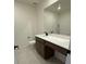Bathroom features a sleek vanity with white countertops and a large mirror at 3667 Inspirato Ave, Henderson, NV 89044