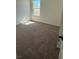 Comfortable bedroom with plush carpeting and bright window at 3667 Inspirato Ave, Henderson, NV 89044