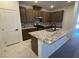 Modern kitchen featuring a center island, granite countertops, and stainless steel appliances at 3667 Inspirato Ave, Henderson, NV 89044