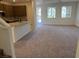 Bright, open-concept living area with plush carpeting and lots of natural light at 3667 Inspirato Ave, Henderson, NV 89044