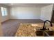 Spacious living room adjacent to kitchen area with granite counters and modern sink at 3667 Inspirato Ave, Henderson, NV 89044