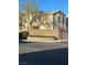 Condo exterior with brick signage showing the community's name on a sunny day at 3672 Angela Robin St # 202, Las Vegas, NV 89129