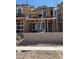 New home under construction showcasing wood framing, window placements, and brick base at 3759 Via Allegro, Henderson, NV 89044
