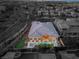 An aerial shot features a modern house with a private pool and putting green in the backyard of a gated community at 39 Cranberry Cove Ct, Las Vegas, NV 89135