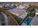 Expansive aerial view showcasing the home's backyard oasis with a pool, putting green, and meticulously landscaped grounds at 39 Cranberry Cove Ct, Las Vegas, NV 89135