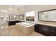 Bright bathroom with a large soaking tub, double vanities, and tiled flooring at 39 Cranberry Cove Ct, Las Vegas, NV 89135