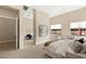 Well-lit bedroom with a large window, plush carpeting, and neutral tones at 39 Cranberry Cove Ct, Las Vegas, NV 89135