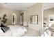 Spacious bedroom features neutral paint, carpet flooring, and an attached seating area at 39 Cranberry Cove Ct, Las Vegas, NV 89135