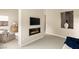 Bedroom with a modern fireplace, accent wall, and sitting area at 39 Cranberry Cove Ct, Las Vegas, NV 89135