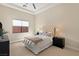 Cozy bedroom with neutral tones, carpet flooring, and a window for natural light at 39 Cranberry Cove Ct, Las Vegas, NV 89135
