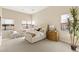 Bright bedroom with a tufted headboard, sitting area, and plenty of natural light at 39 Cranberry Cove Ct, Las Vegas, NV 89135