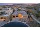 Contemporary home with a three-car garage, desert landscaping, and elegant stone accents at 39 Cranberry Cove Ct, Las Vegas, NV 89135