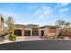 Contemporary desert home featuring desert landscaping, large windows and three car garage at 39 Cranberry Cove Ct, Las Vegas, NV 89135