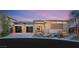 Striking single-story home featuring a modern design, three-car garage, and beautiful desert landscaping at 39 Cranberry Cove Ct, Las Vegas, NV 89135