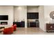 Living room featuring custom cabinets, wine fridge, and modern fireplace, perfect for entertaining at 39 Cranberry Cove Ct, Las Vegas, NV 89135