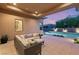Inviting outdoor living space featuring a comfortable lounge area and a sparkling swimming pool at 39 Cranberry Cove Ct, Las Vegas, NV 89135