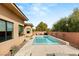 This backyard features a modern pool with lounge chairs and a meticulously landscaped garden at 39 Cranberry Cove Ct, Las Vegas, NV 89135