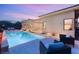 Inviting backyard featuring a sparkling pool, lounge chairs, and cozy seating area, perfect for outdoor relaxation and entertainment at 39 Cranberry Cove Ct, Las Vegas, NV 89135